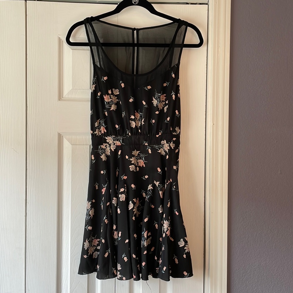 Kimchi Blue black floral fit and flare dress with illusion straps and back.